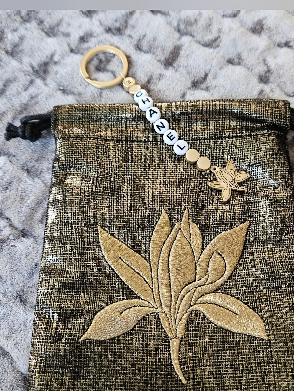 Chanel Sublimage Gold and White Keychain and Black/Gold Pouch